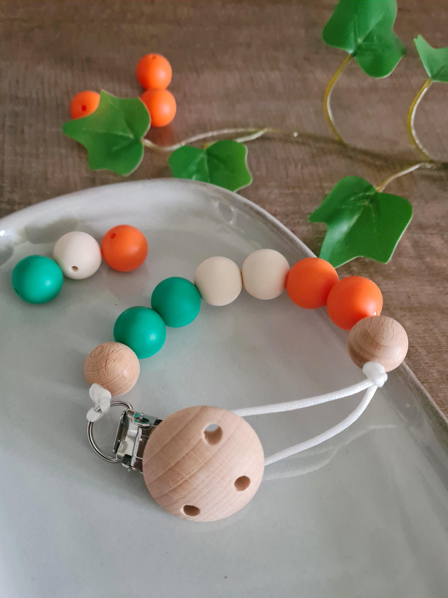 Cute handmade soother clips that display the colours of the Irish flag. A unique present for the newborns and toddlers of Ireland! 