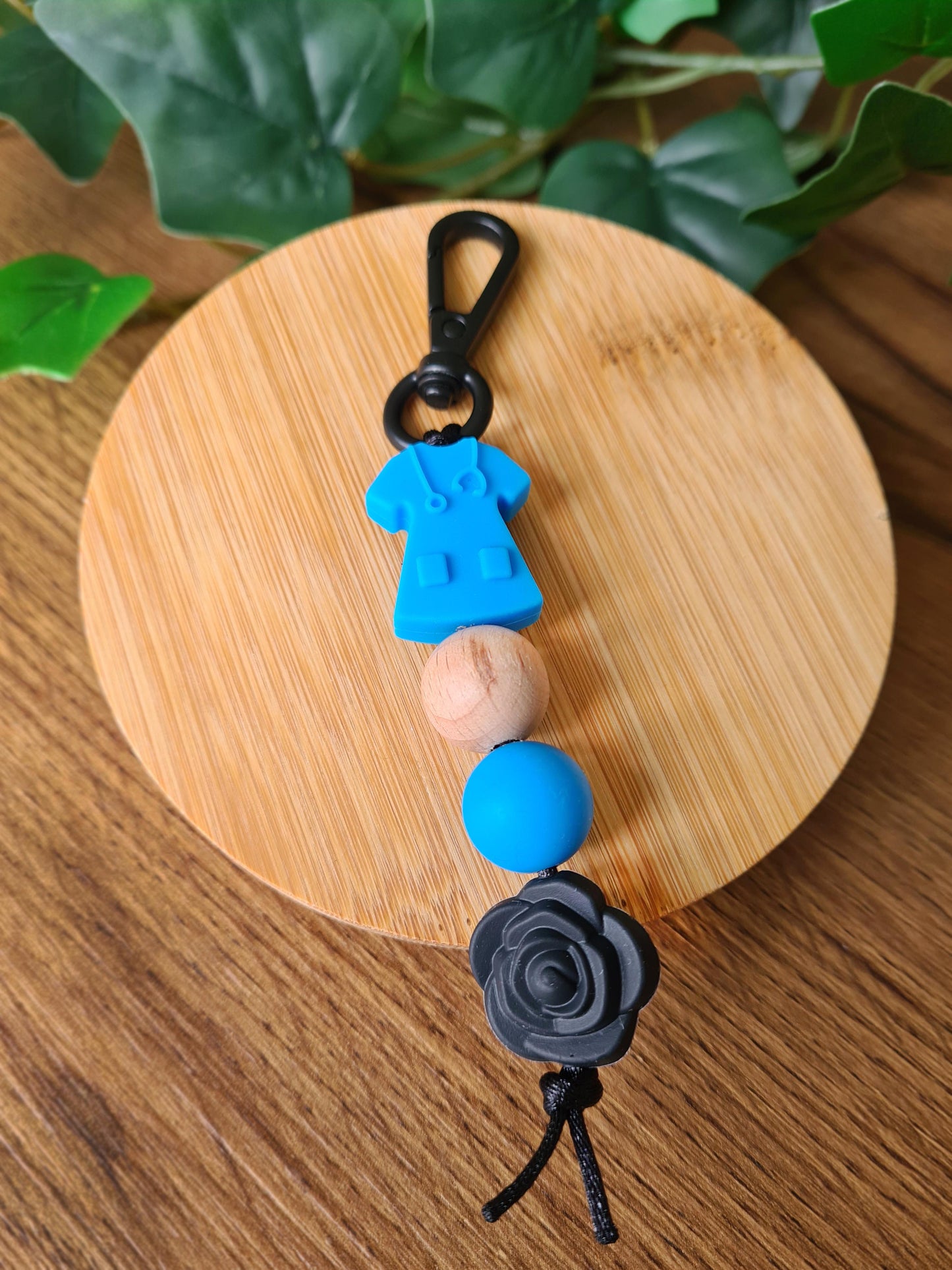 Our handmade keychains make the perfect gift for those amazing medical people in our lives. This keychain / zip puller comes with a blue scrub shaped bead.