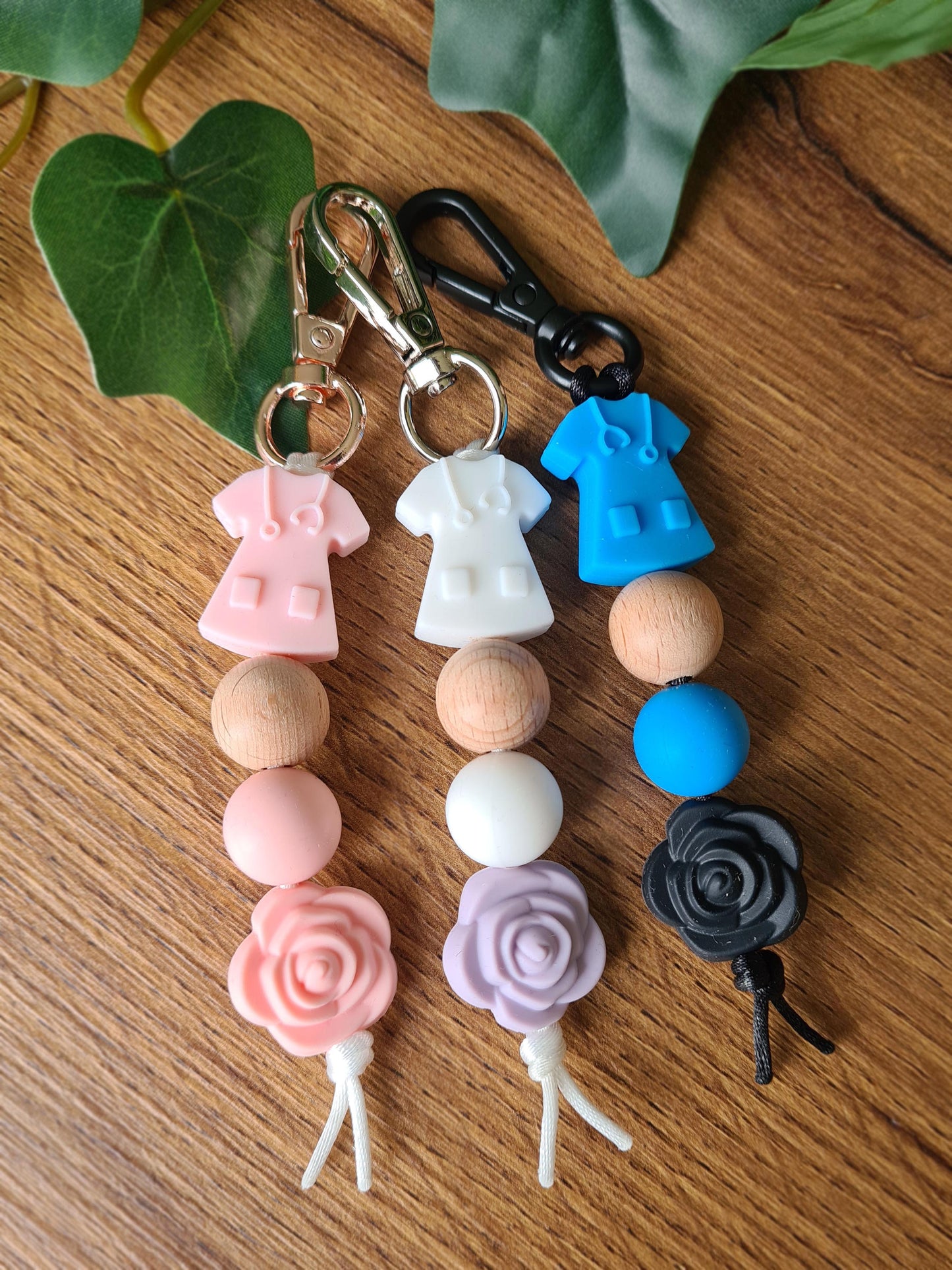 Our handmade keychains make the perfect gift for those amazing medical people in our lives. This keychain / zip puller comes with a pink scrub shaped bead.