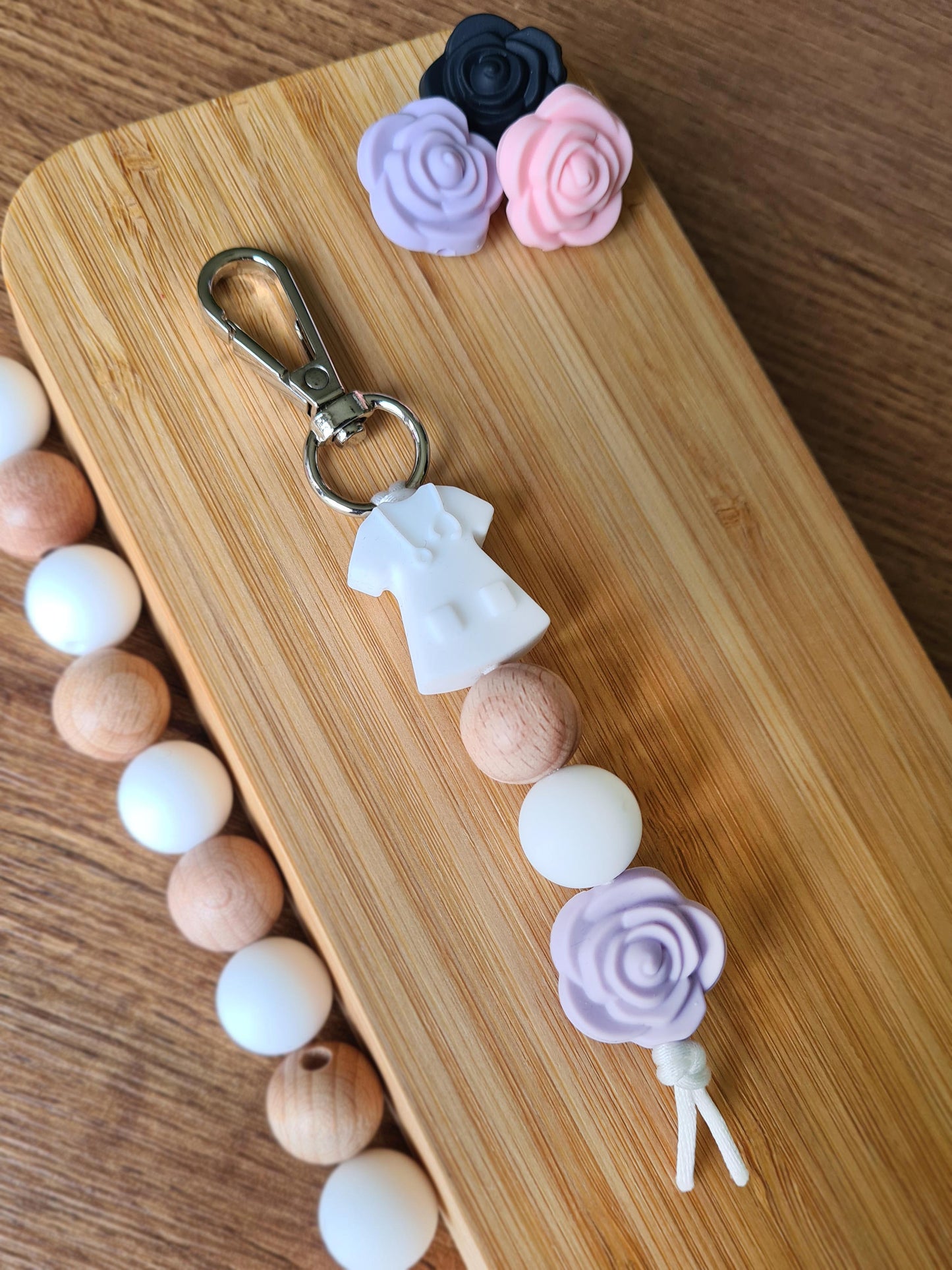 Our handmade keychains make the perfect gift for those amazing medical people in our lives. This keychain / zip puller comes with a white scrub shaped bead.