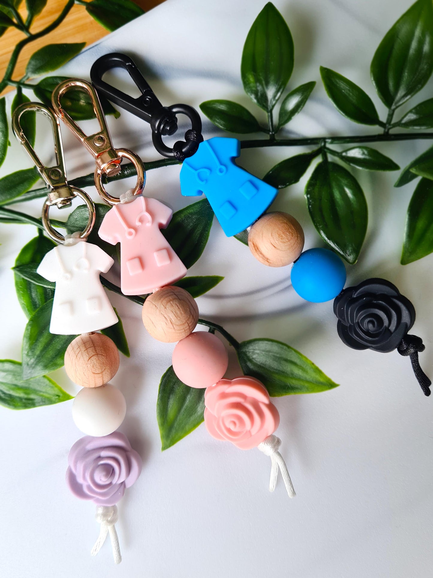 Our handmade keychains make the perfect gift for those amazing medical people in our lives. This keychain / zip puller comes with a pink scrub shaped bead.