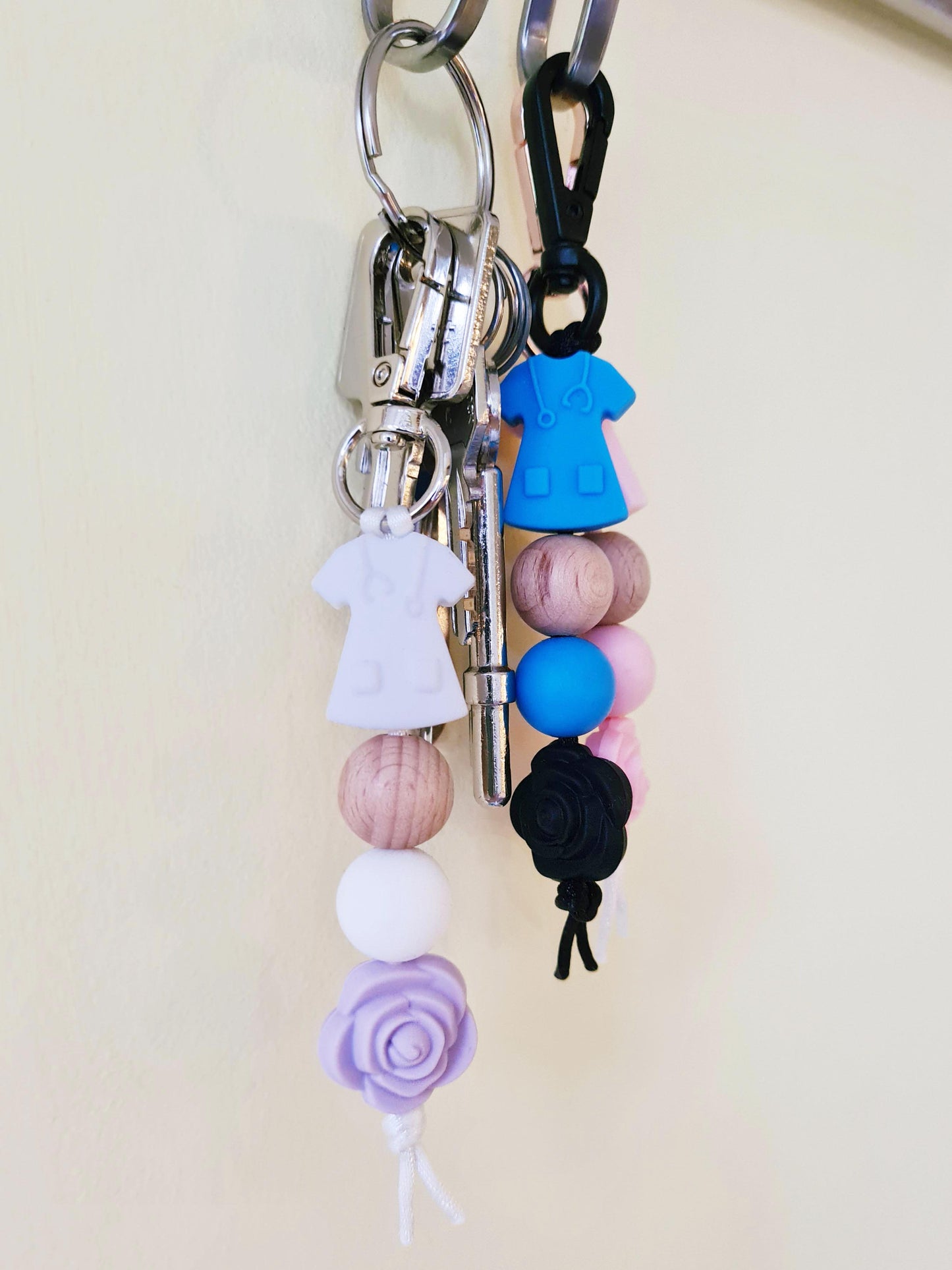 Our handmade keychains make the perfect gift for those amazing medical people in our lives. This keychain / zip puller comes with a white scrub shaped bead.