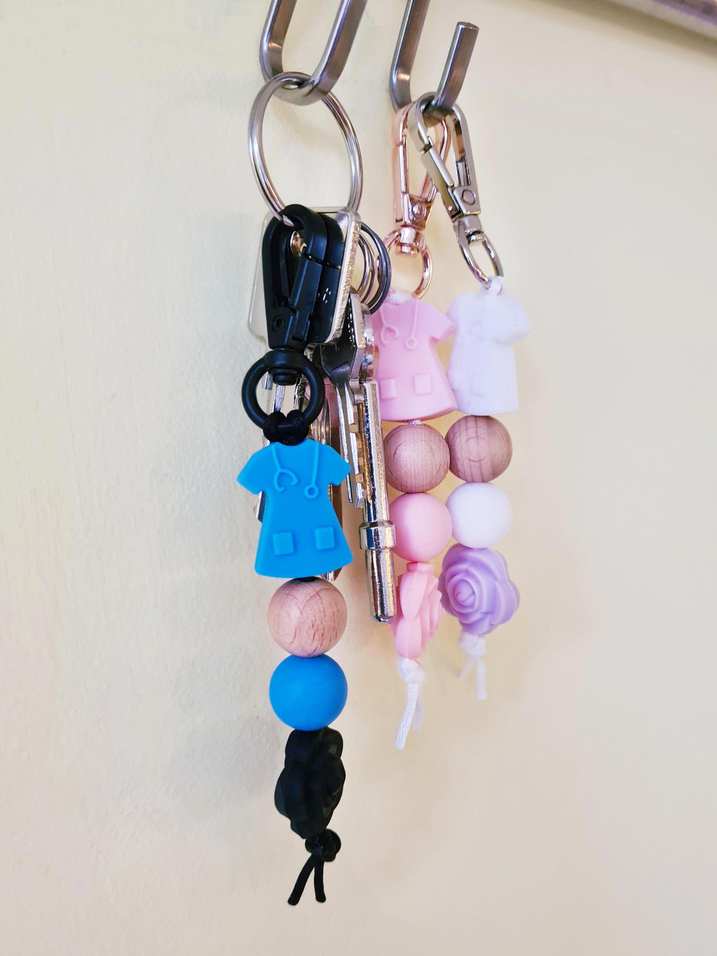 Our handmade keychains make the perfect gift for those amazing medical people in our lives. This keychain / zip puller comes with a blue scrub shaped bead.