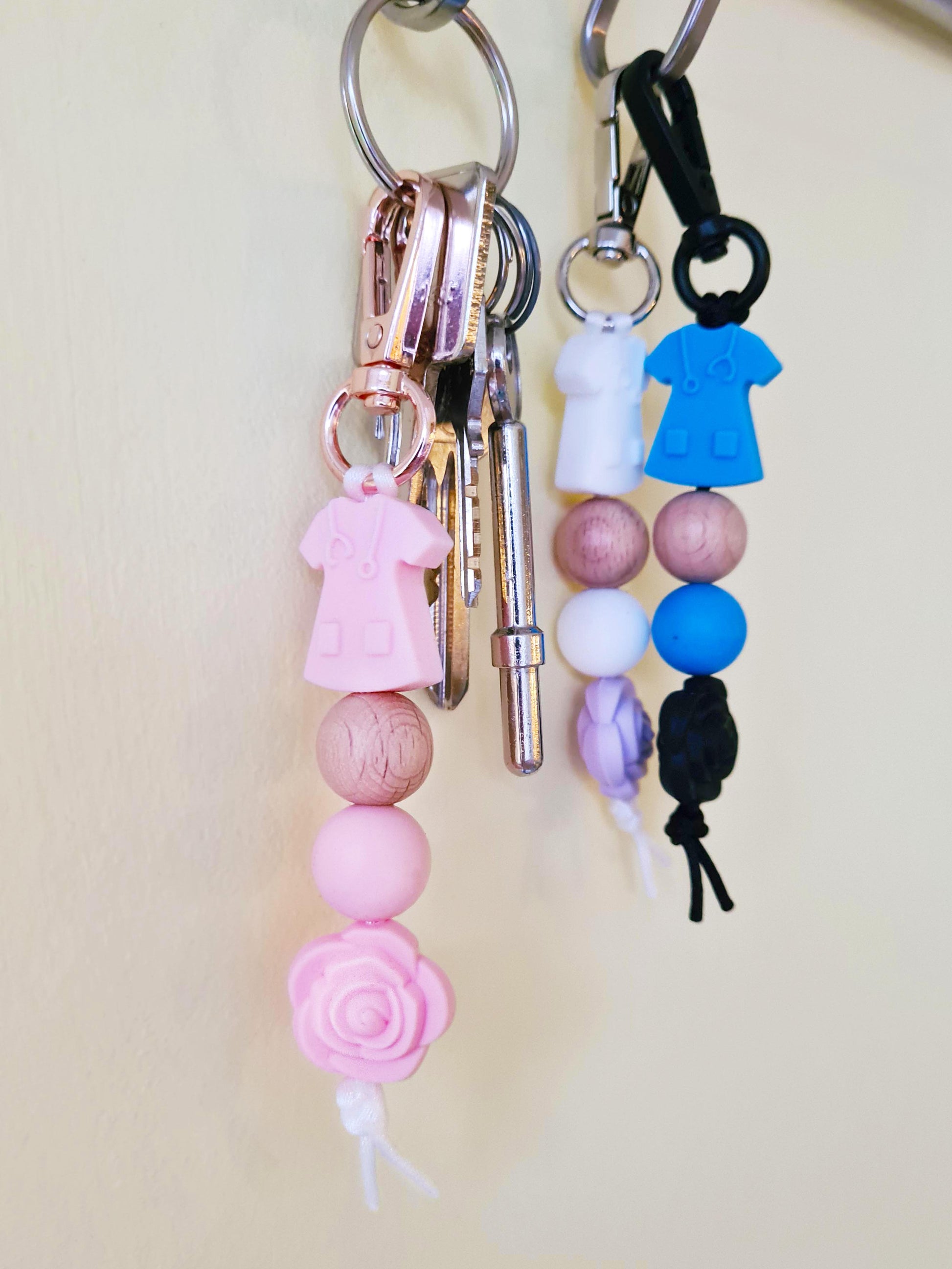 Our handmade keychains make the perfect gift for those amazing medical people in our lives. This keychain / zip puller comes with a pink scrub shaped bead.