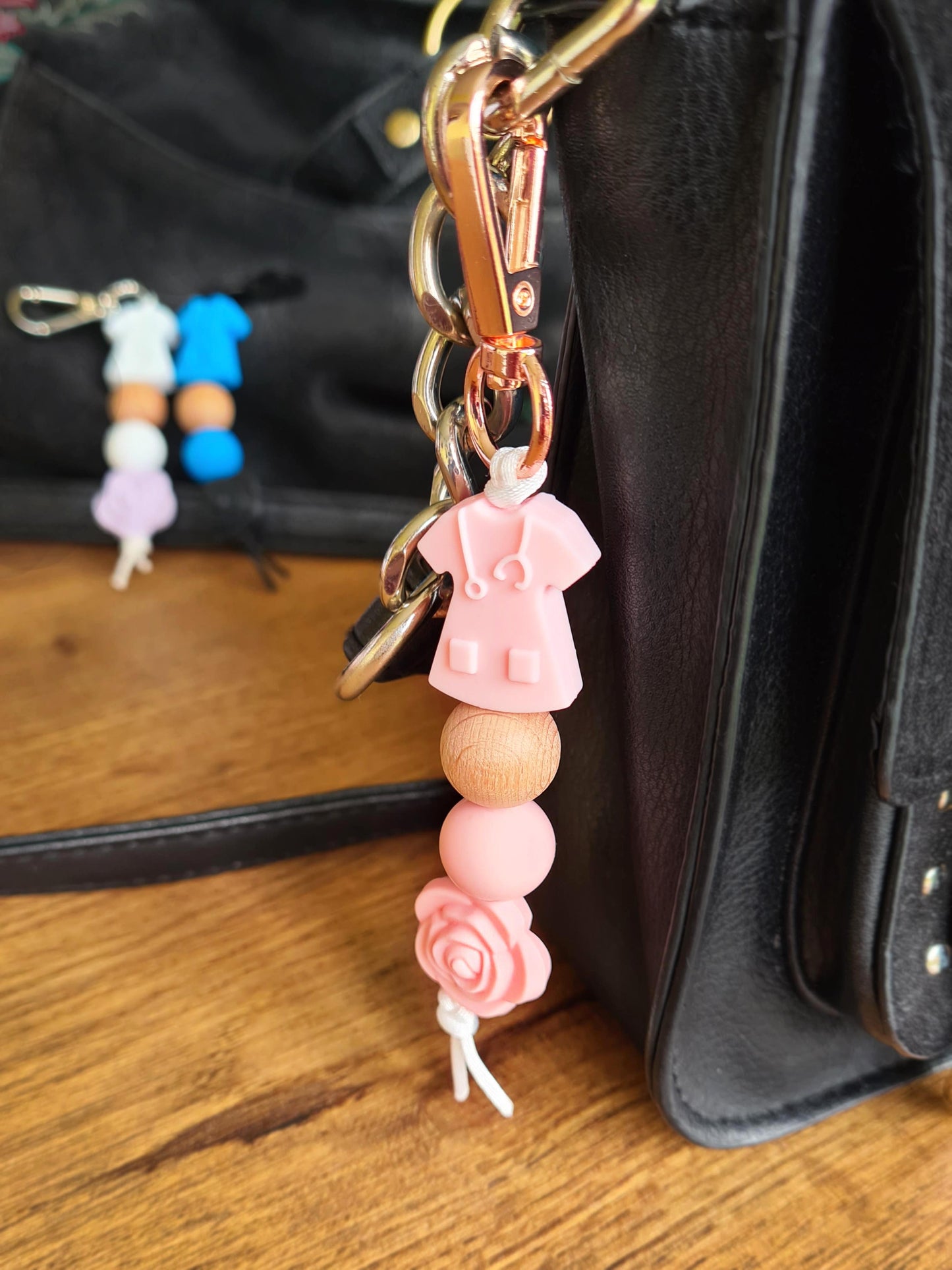 Our handmade keychains make the perfect gift for those amazing medical people in our lives. This keychain / zip puller comes with a pink scrub shaped bead.