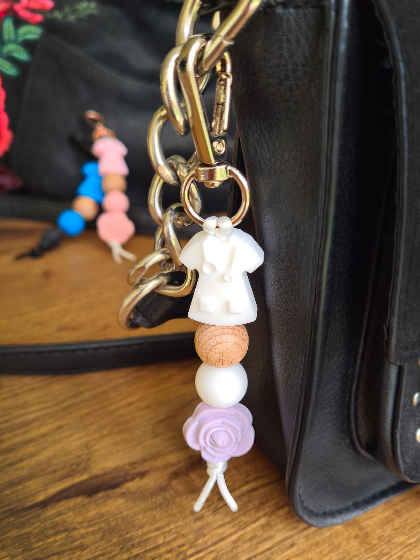 Our handmade keychains make the perfect gift for those amazing medical people in our lives. This keychain / zip puller comes with a white scrub shaped bead.