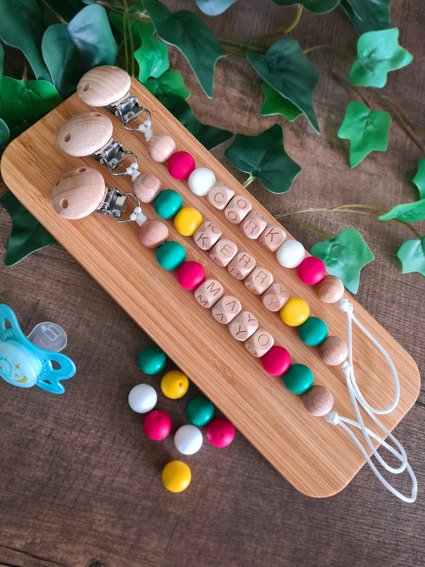 Cute handmade soother clips for the Mayo football GAA fans. Unique gift ideas for newborns and toddlers. Handcrafted Irish made. Features the Mayo colours. 