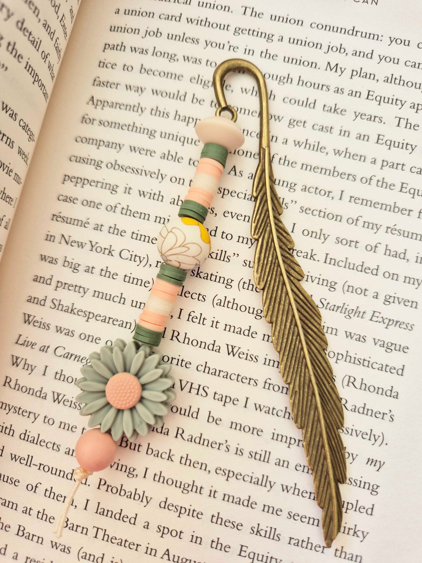 A lavish bronze feathered bookmark. The perfect gift for yourself, or for that special book lover in your life!