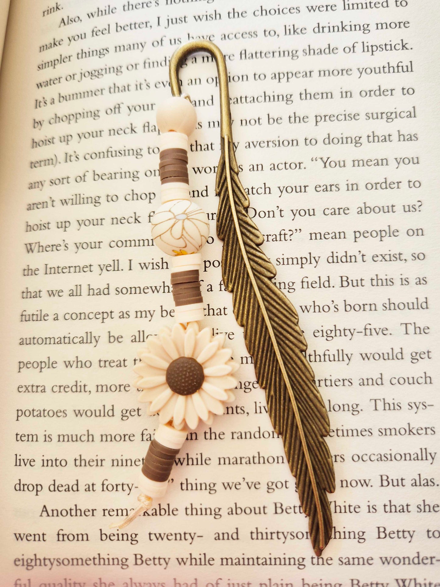 A lavish bronze feathered bookmark. The perfect gift for yourself, or for that special book lover in your life!