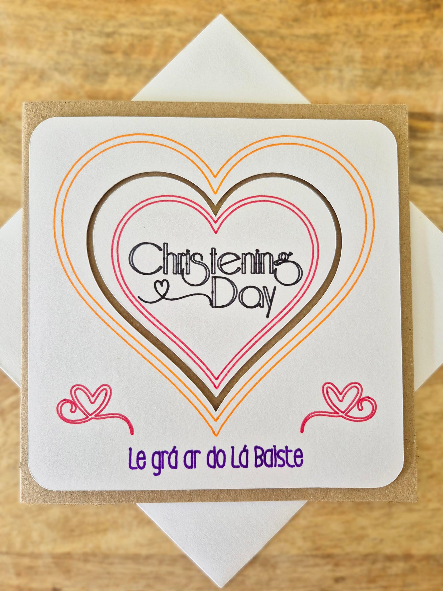 Do you know of any little person who is celebrating their Christening Day? Well, we've got the card for you! Le grá ar do Lá Baiste. Say it As Gaelige with this handmade Christening Gift!