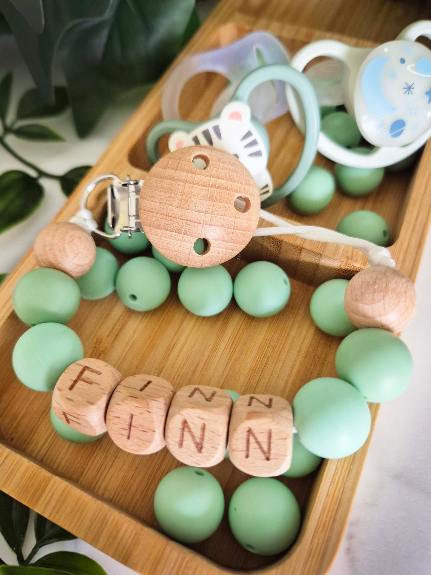 Personalised soother clips with name. Perfect as a Christening gift, a birthday gift or a gift for a newborn.