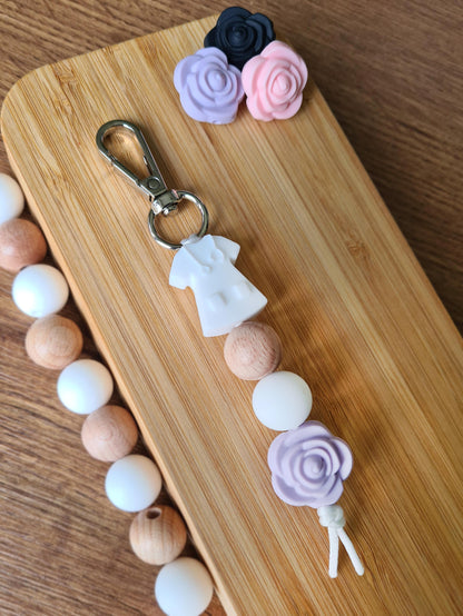 Our handmade keychains make the perfect gift for those amazing medical people in our lives. This keychain / zip puller comes with a white scrub shaped bead.