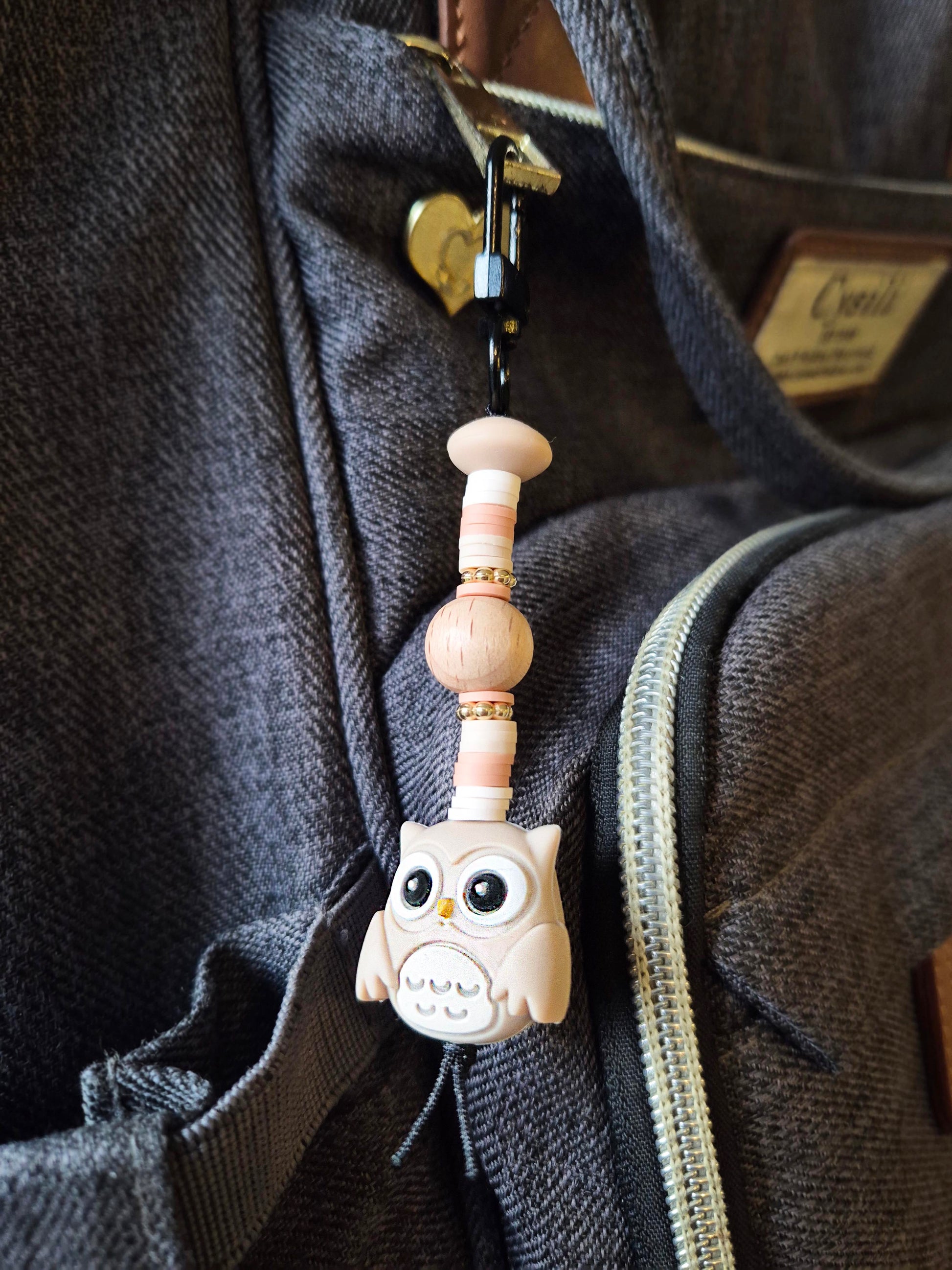 Beige Owl keyring on Backpack