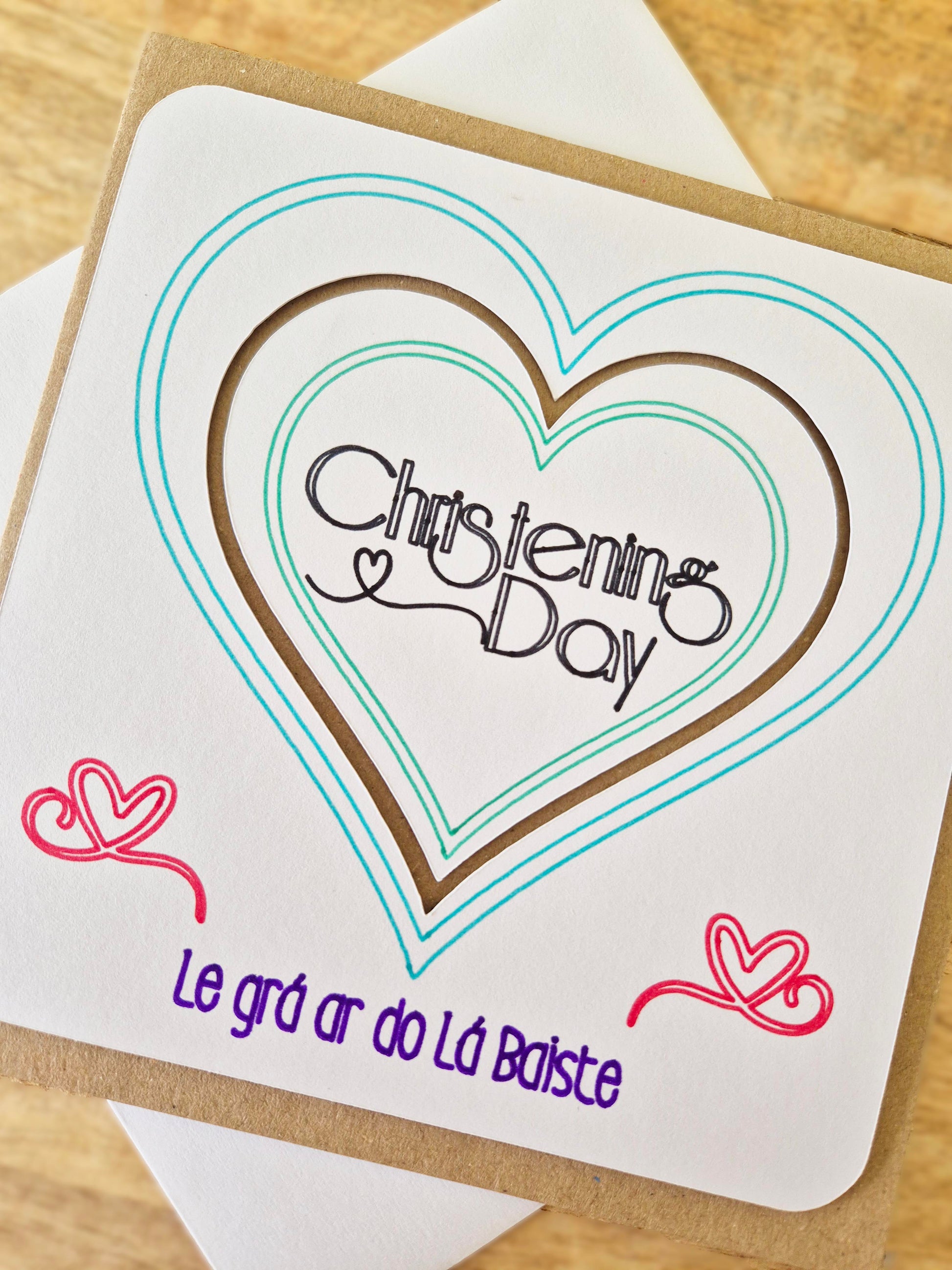 Do you know of any little person who is celebrating their Christening Day? Well, we've got the card for you! Le grá ar do Lá Baiste. Say it As Gaelige with this handmade Christening Gift!