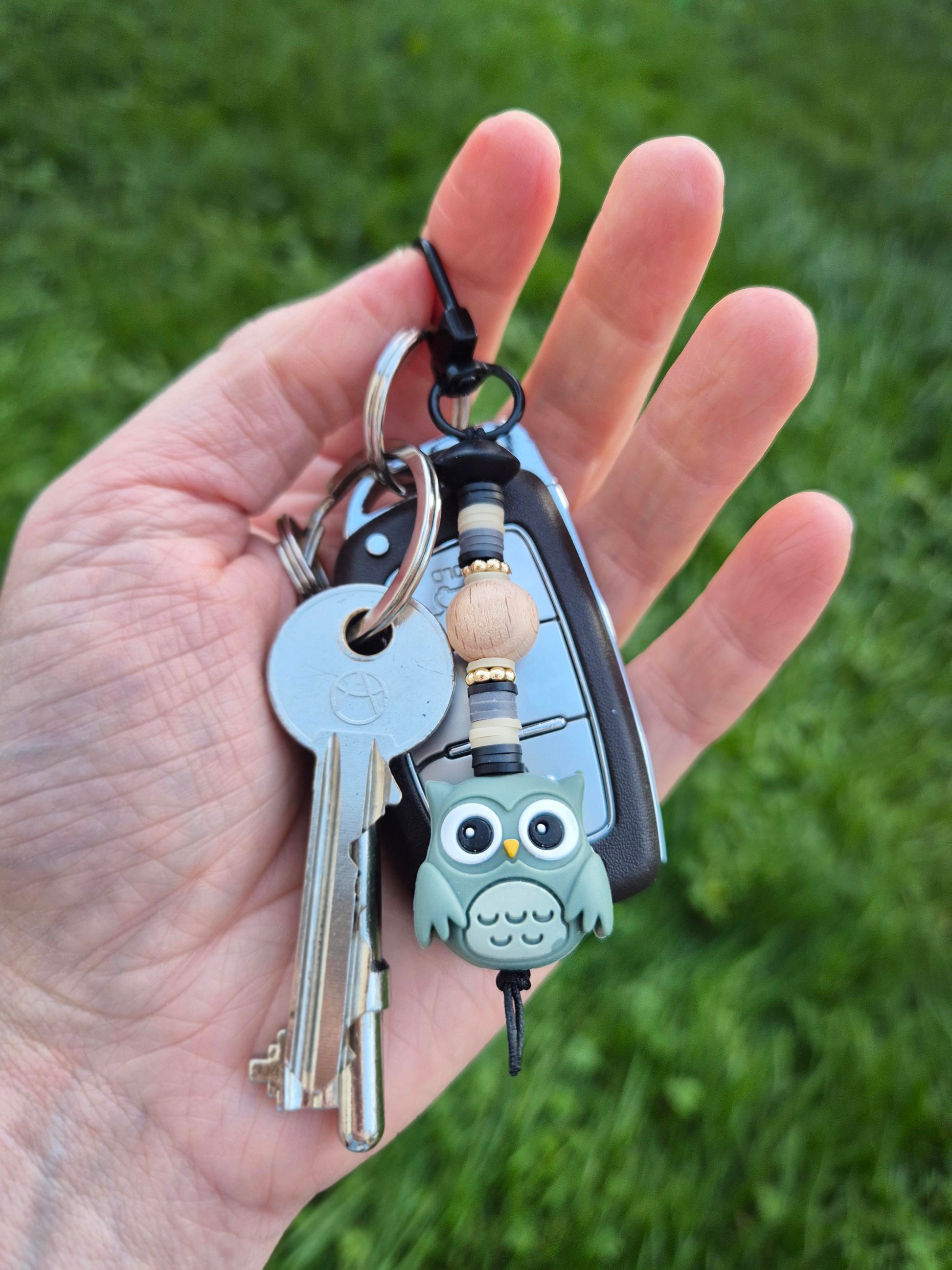 Green owl keychain on a set of keys