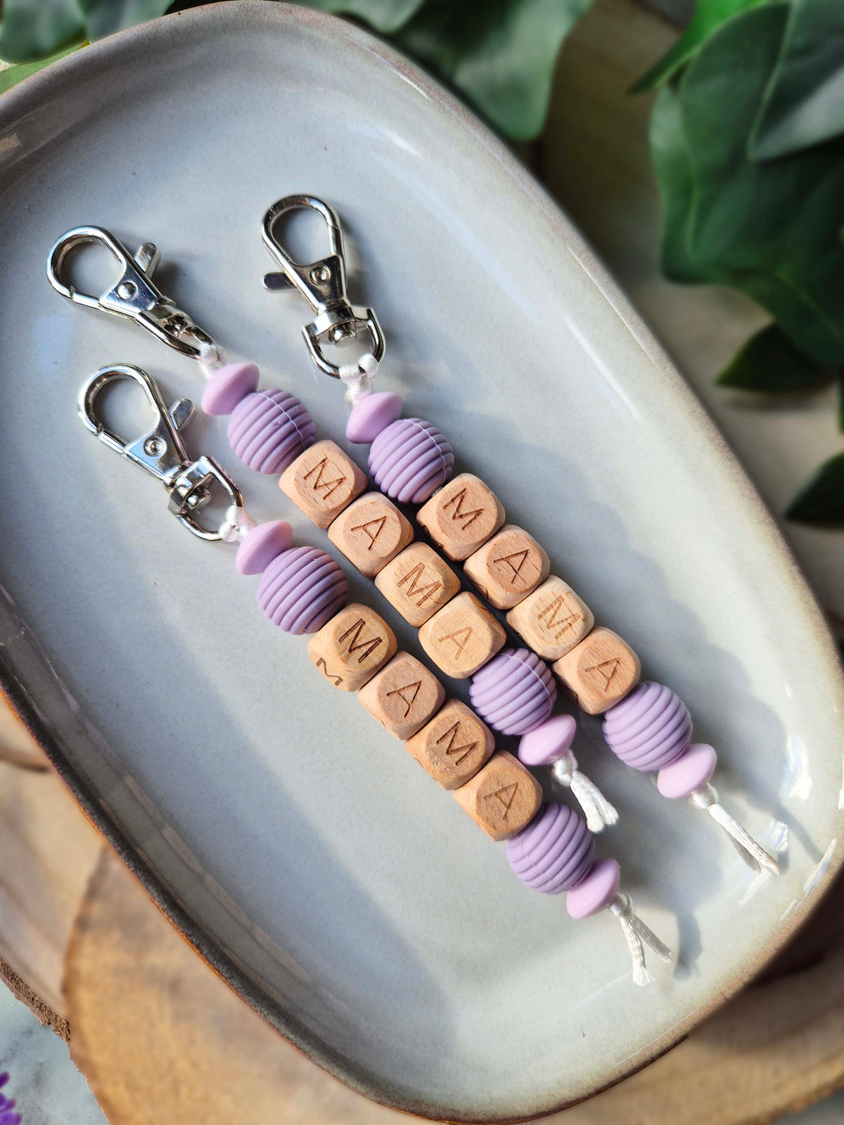 Two handmade Mama keyrings side by side, gifts for new mums