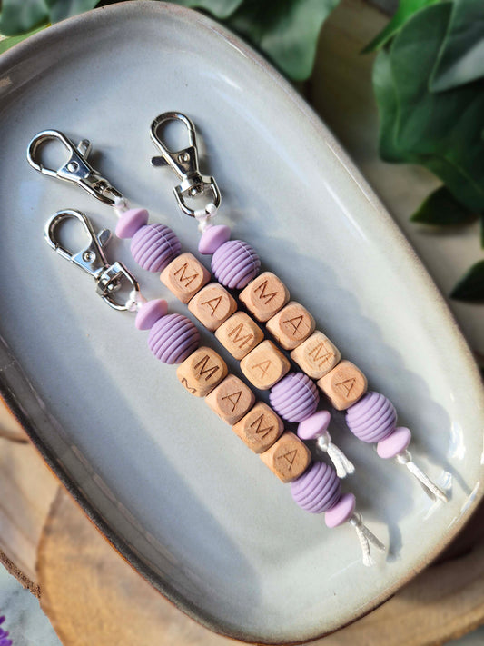 Two handmade Mama keyrings side by side, gifts for new mums