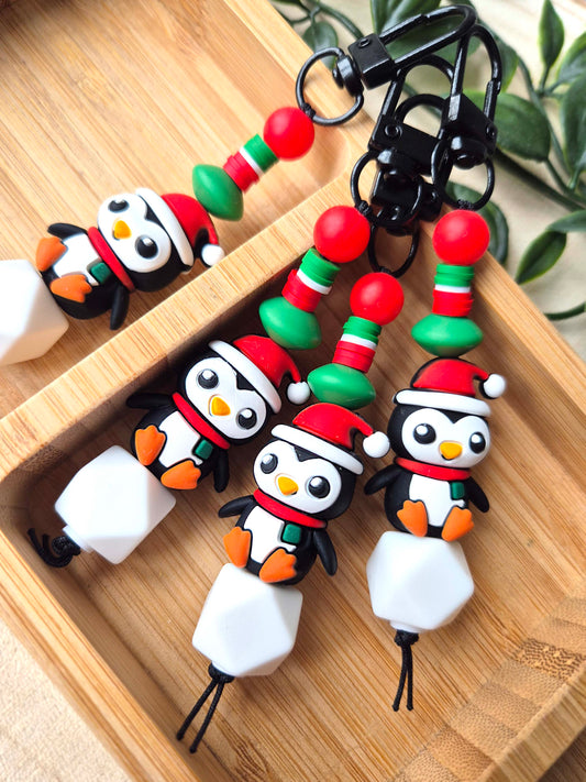 Just Chillin' penguin keyring with a penguin sitting on an iceberg, silicone and heishi beads
