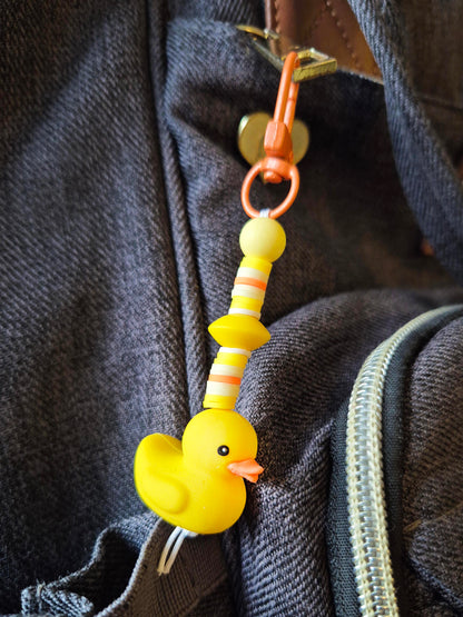 Rubber duck keychain on a backpack