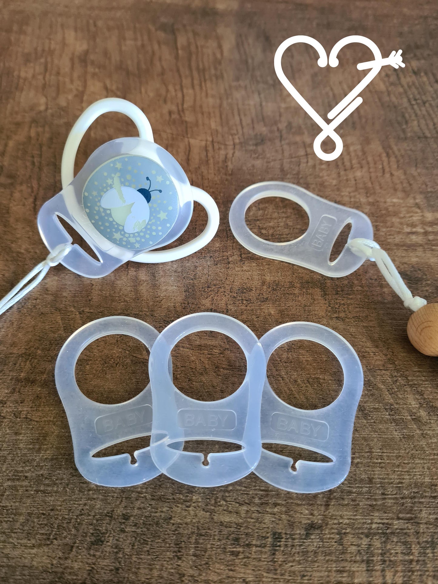 These adapters are for use with soothers that don't have a 'handle' on them. Use these adapters to attach the cord from the soother clips onto the soother.