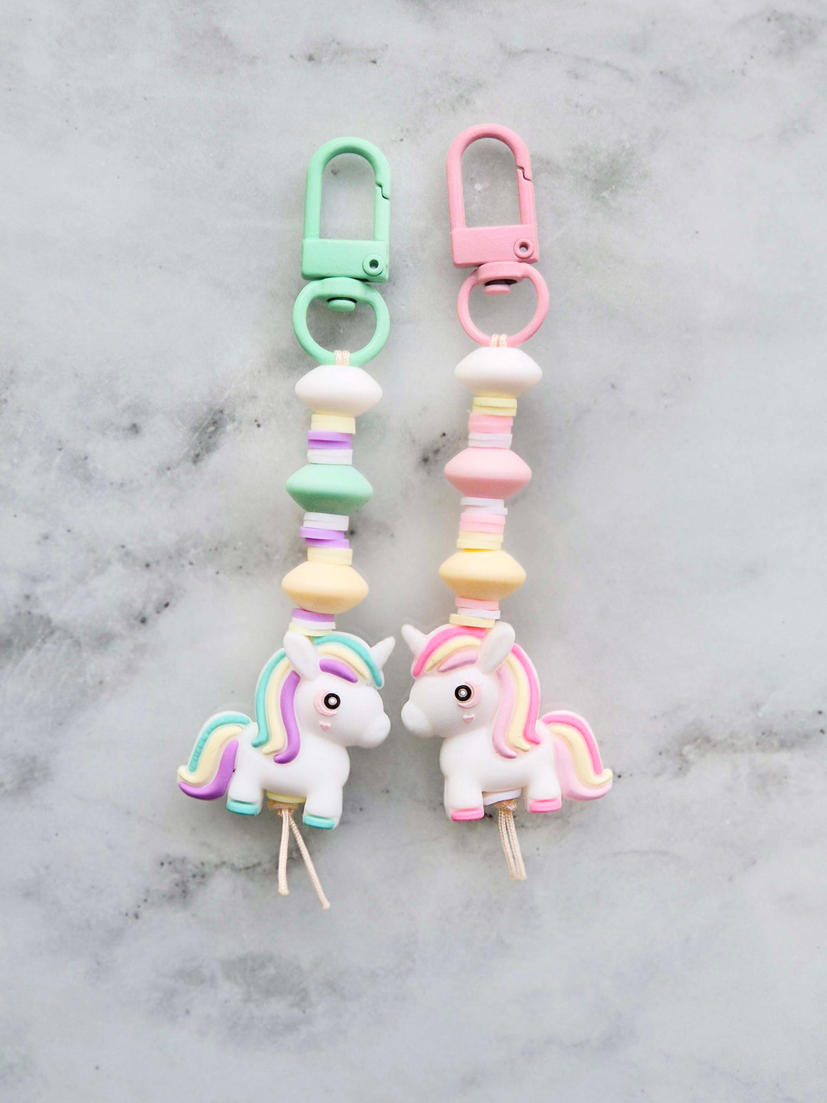 Handmade pastel unicorn beaded keychain zip puller in light pink and mint green