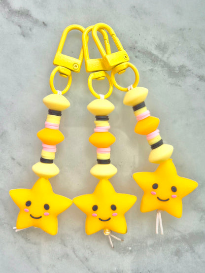 Réalta yellow smiley star keychains made from silicone and heishi beads